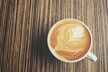 Vintage latte art coffee with shadow