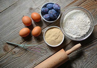 Fototapeta na wymiar Baking plum cake in rural kitchen