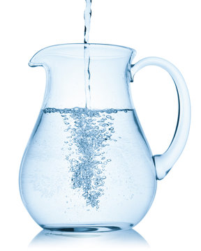 Pouring water from glass pitcher on white background Stock Photo by  ©Santiaga 80532748