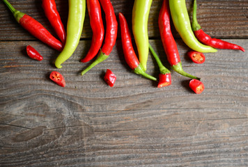 Chilly pepper ( yellow and red ) on the wooden background