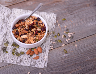 Fototapeta premium Granola from several types of cereals with nuts,coconut chips an