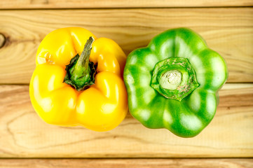 Spicy Green and yellow capsicum on chopping board
