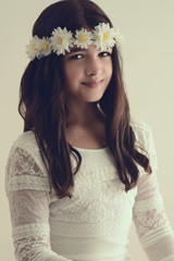 Fototapeta premium Portrait of young girl with flower headband