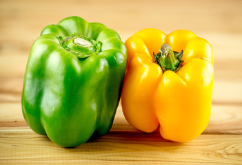 Organic ripe green and yellow capsicum peppers