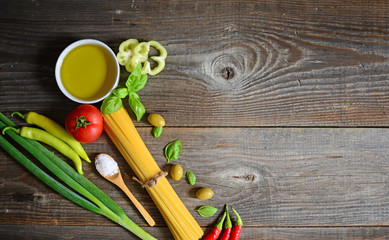 Naklejka premium Ingredients for spaghetti on wooden background, closeup