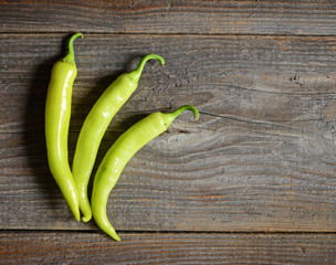 Yellow pepper on the wooden background