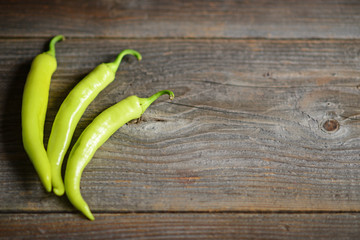 Yellow pepper on the wooden table