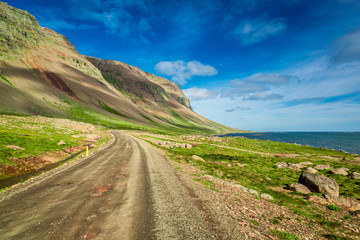 Mountain road near the Arctic sea in Iceland