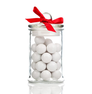 White Candies, Gumballs In Glass Jar, Over White Background