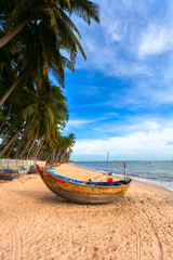 Fototapeta na wymiar The Vietnamese boat on a sea beach