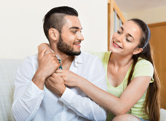 Cheerful man and woman embracing