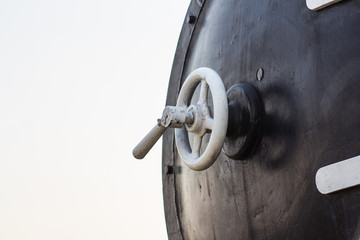 Detail of the brass front valve of an old steam train boiler.