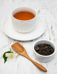 Cup of tea with jasmine flowers