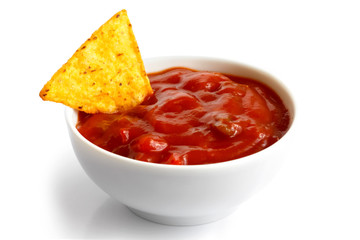 Round white bowl of tomato salsa dip isolated in perspective. To - obrazy, fototapety, plakaty