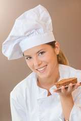 Baker holding a chocolate dessert