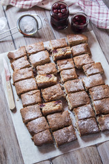 Sliced sweet cake with cherries