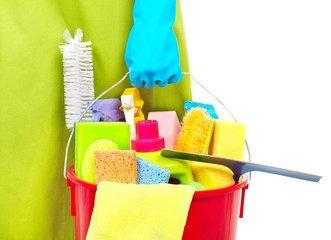 Maid hands with cleaning tools.