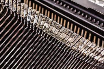 Old typewriter letters on type bar