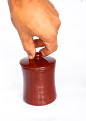 Hand and Coffee or tea glass on white background.