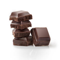 Pieces of black Chocolate isolated on white