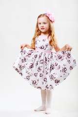 Naklejka premium Full length portrait of a cute little dancing girl