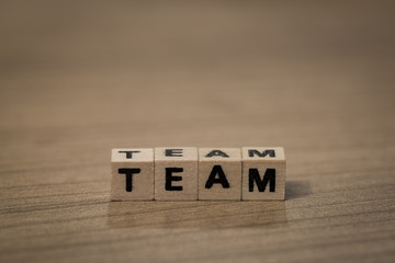 Team in wooden cubes