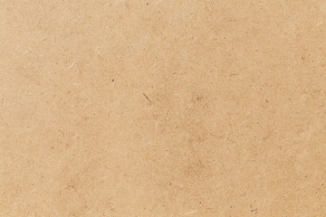 Pressed beige chipboard texture.