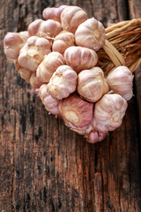 Garlic on old wooden background