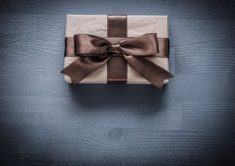 Present box on vintage wooden board holiday concept