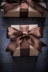 Present boxes with tied ribbons on vintage wood board