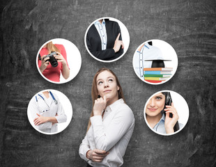 A beautiful young lady in a formal shirt is thinking about different professions. Black chalkboard...