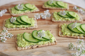Green cucumber and avocado wholegrain rectangle crackers with co