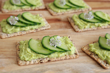 Green cucumber and avocado wholegrain rectangle crackers with co