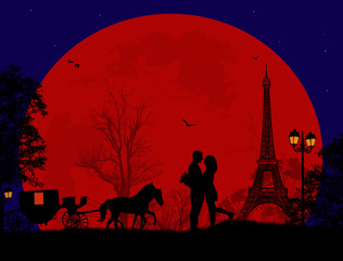 Carriage and lovers at night in Paris