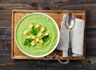 bowl of broccoli and green peas cream soup
