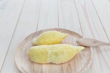 yellow Durian in wooden plate on wood table
