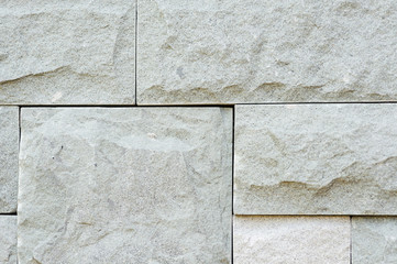 Grey granite stone brick on the wall
