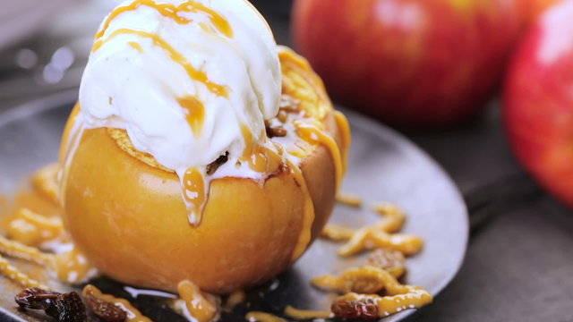 Organic baked apples served with vanilla ice cream