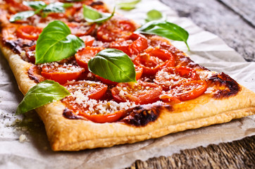 Pie with tomatoes, cheese and Basil