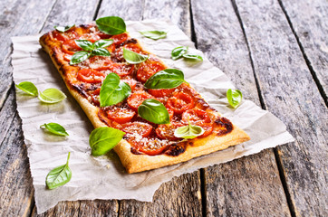 Pie with tomatoes, cheese and Basil