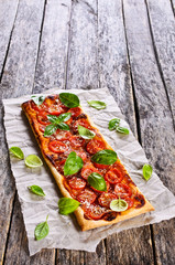 Pie with tomatoes, cheese and Basil