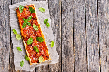 Pie with tomatoes, cheese and Basil