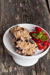Oatmeal cookies with milk and fresh berries, vertical, close up