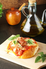 Italian pizza with ham and sausage