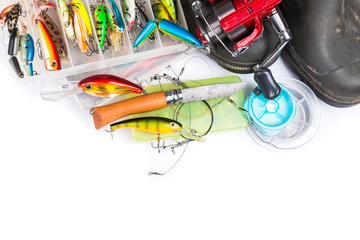fishing tackles and rubber boots on white