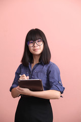 Asian teen writing tablet