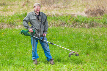 Lawnmower man green field cultivating