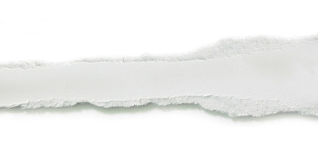 Obraz premium close up of a white ripped piece of paper on white background