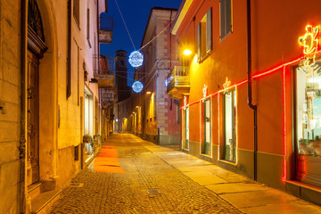 Fototapeta na wymiar Decorated street of Alba in the evenig.