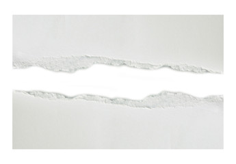 Hole ripped in white paper